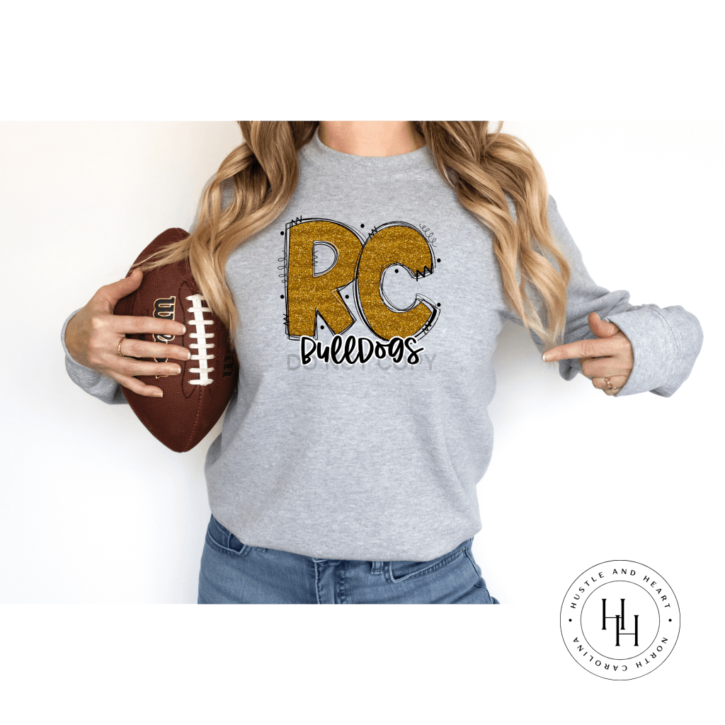 Rc Bulldogs Old Gold Glitter Varsity Doodle Graphic Tee Unisex Tee